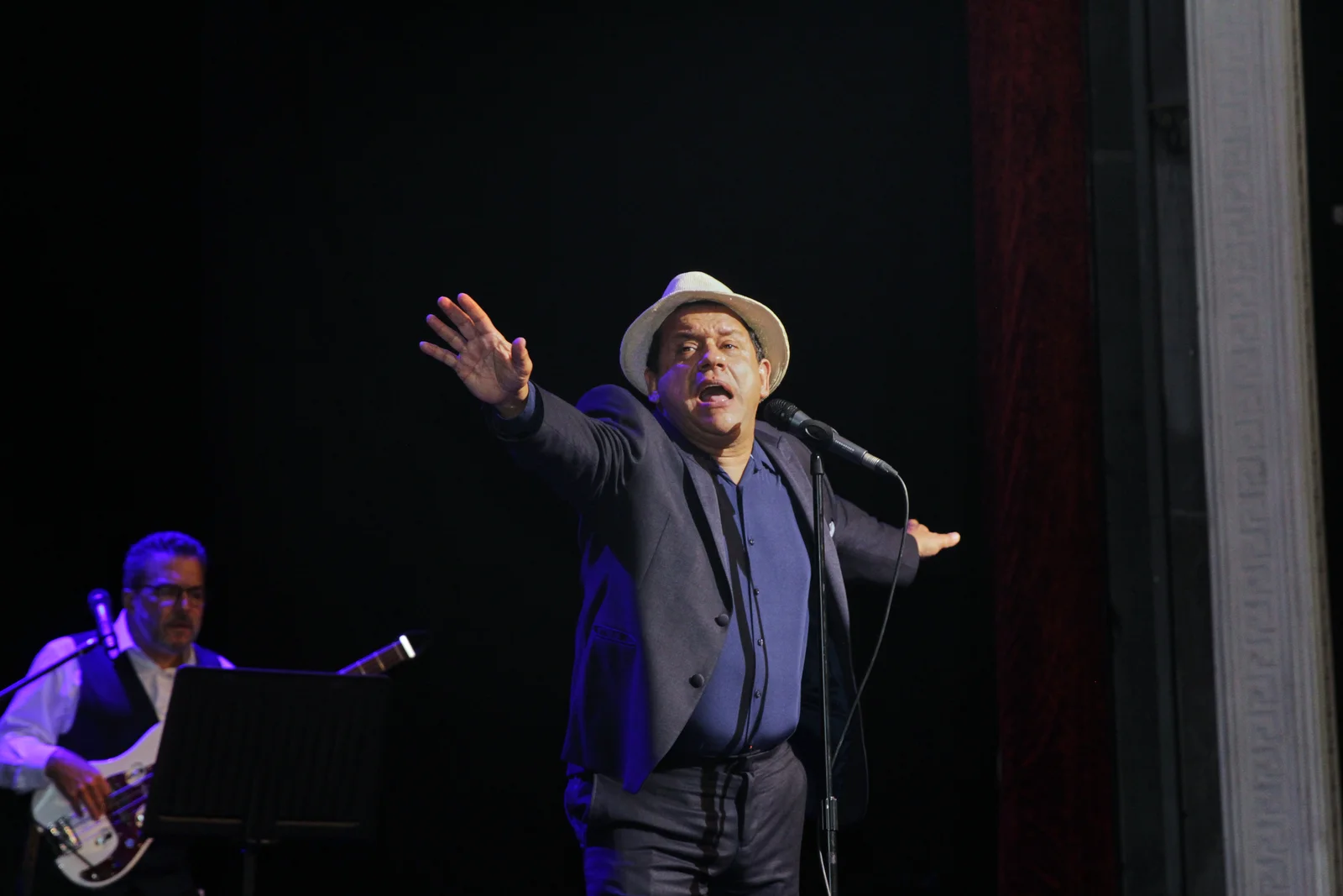Comedian on stage under a spotlight