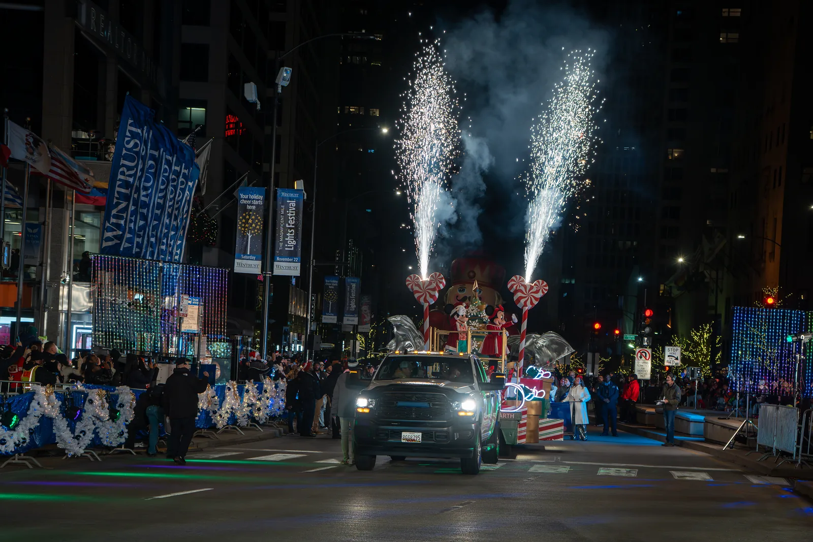 Sparkler fountains over the parade on Michigan Avenue at the Wintrust Magnificent Mile Lights Festival