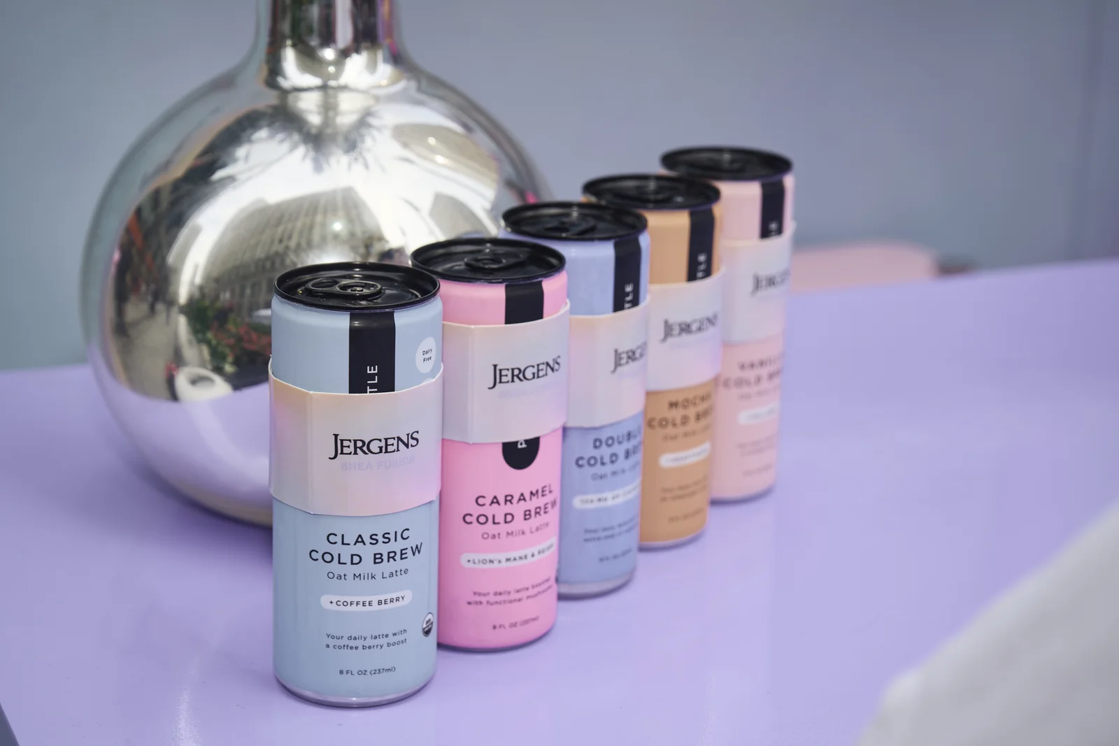 Jergens cold brew lineup on a pink set