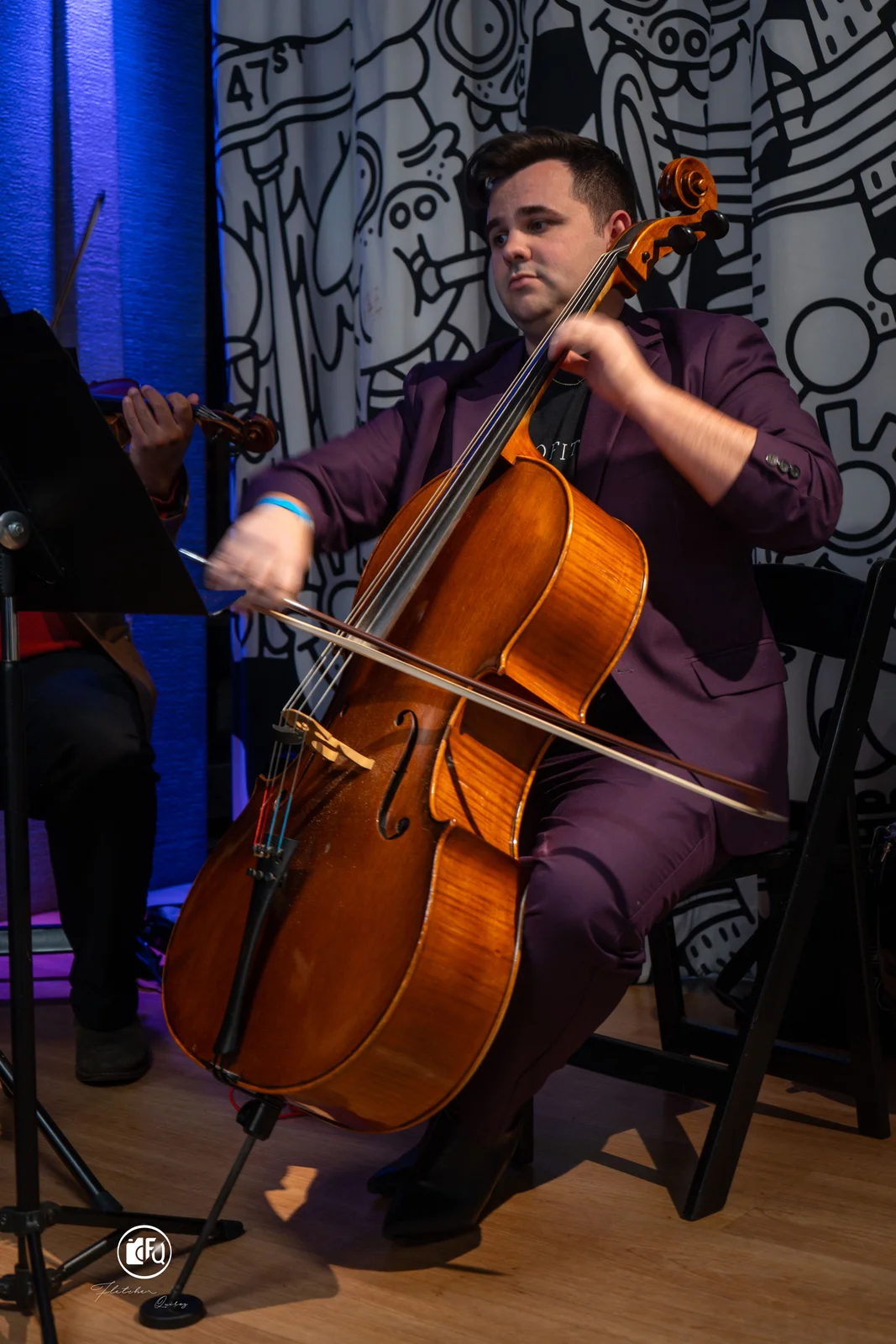 Cellist performing at an OutPro 360 evening