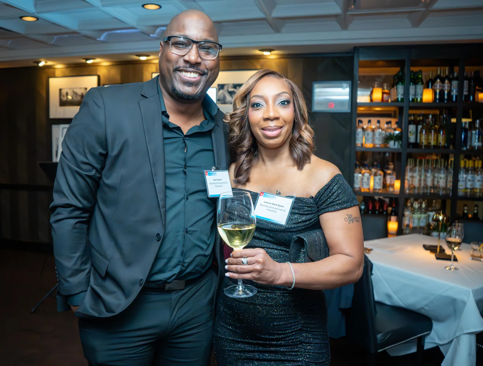 Guests with a glass of wine at the Magnificent Mile Association legislative reception